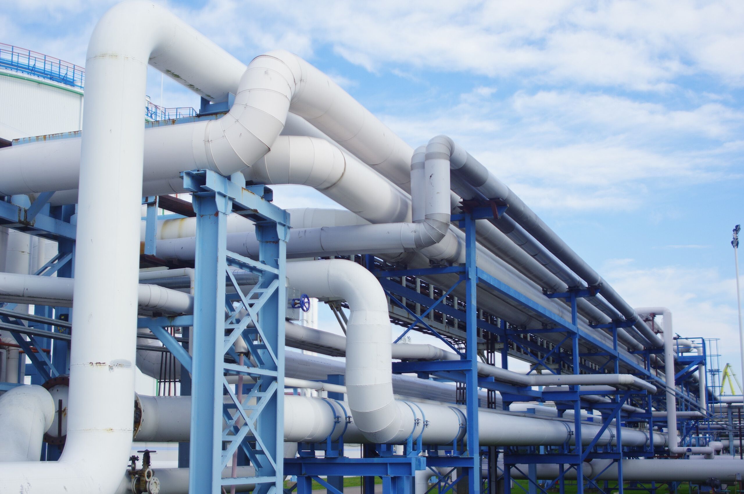 closeup-industrial-pipelines-around-factor-sunny-day-scaled.jpg