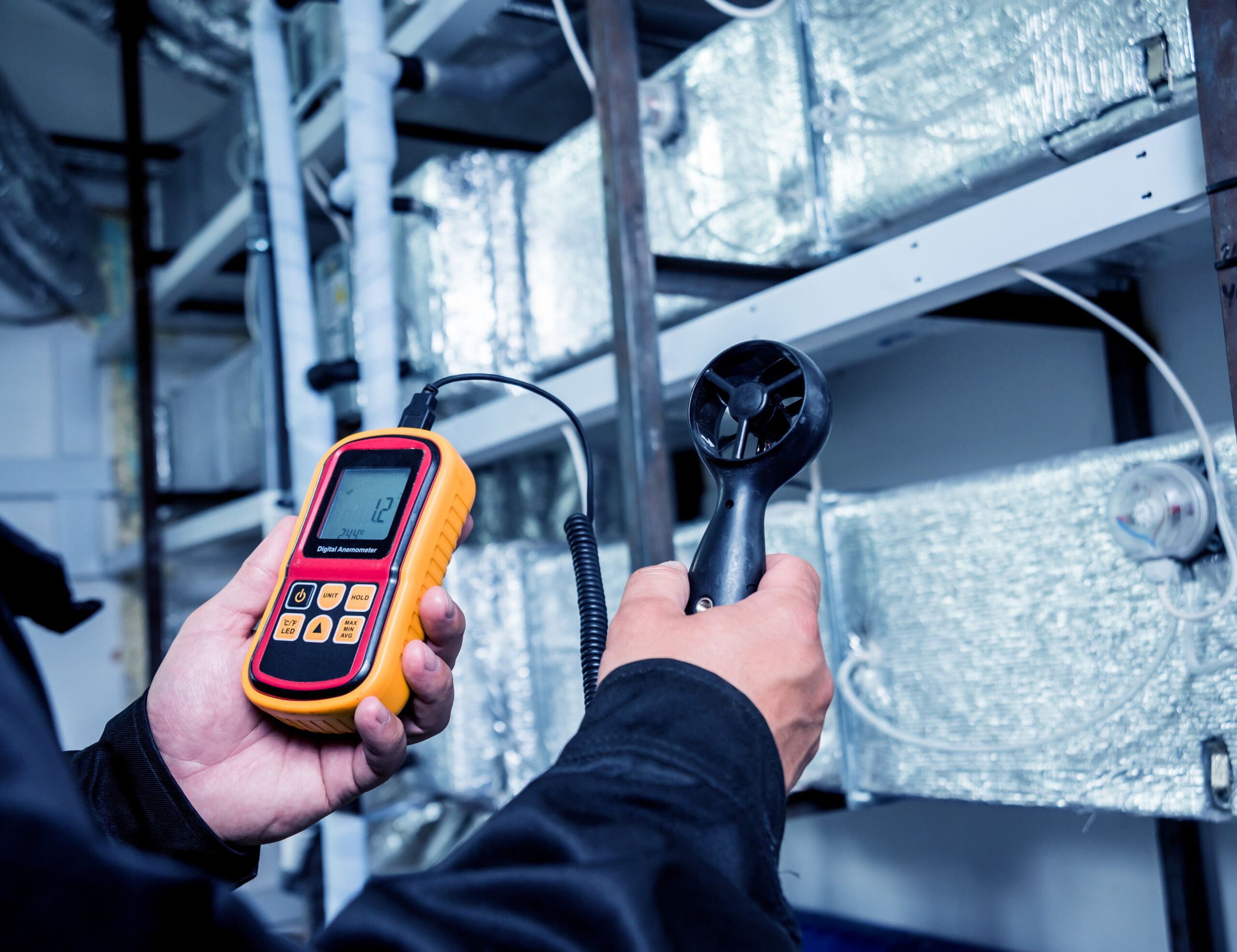 technician-use-hand-held-anemometer-measuring-air-flowing-measurement-wind-speed-pressure-scaled.jpg