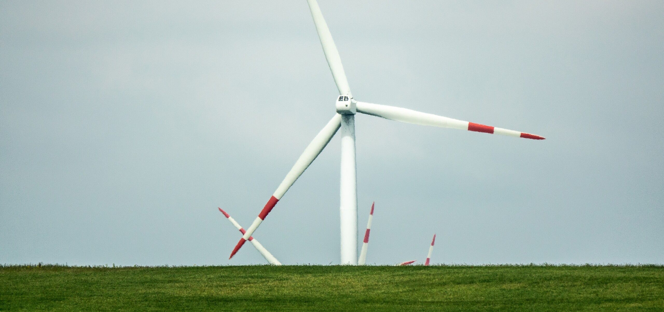 wind-fan-standing-green-landscape-daytime-scaled.jpg